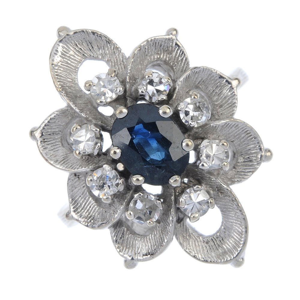 An 18ct gold sapphire and diamond cluster ring. (1 of 4)
