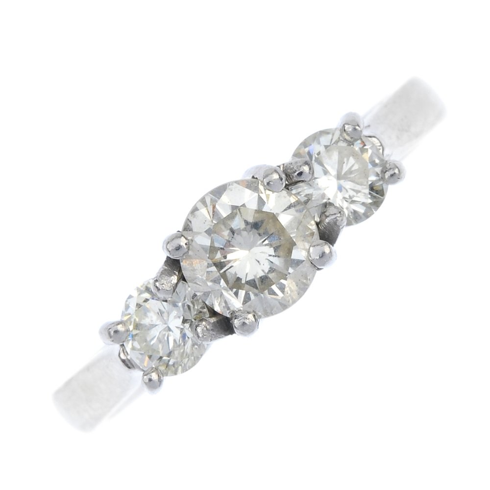 A platinum diamond three-stone ring. (1 of 4)