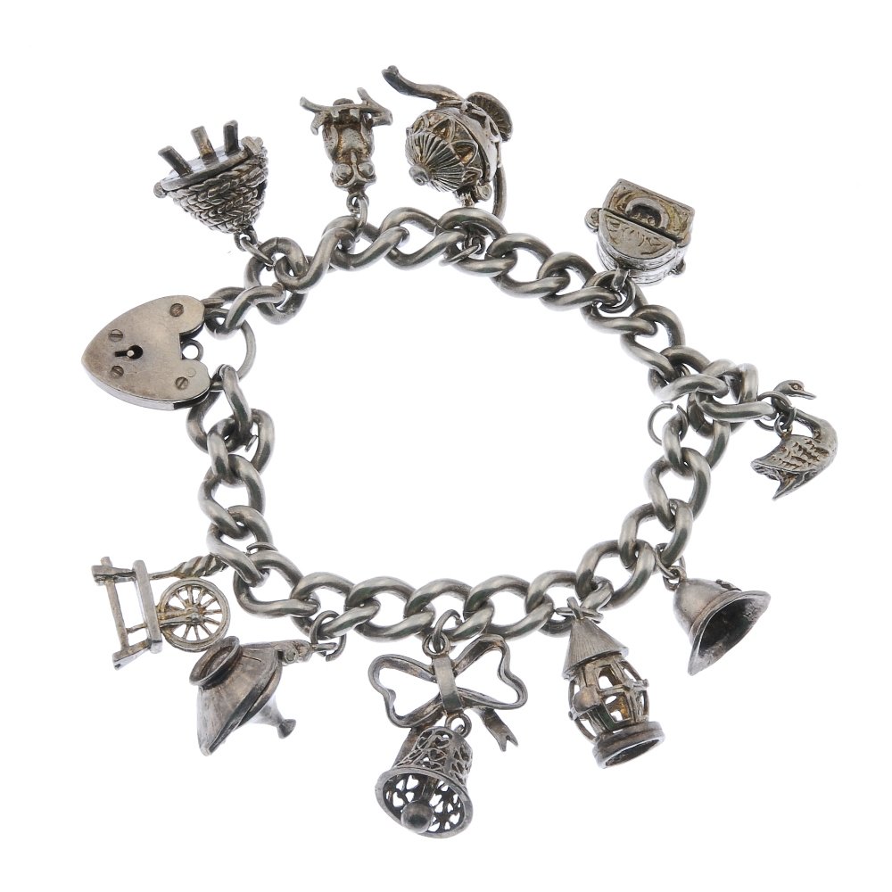 Four charm bracelets and a selection of loose charms.: Four charm bracelets and a selection of loose charms. To include two curb-link and two fancy-link bracelets, suspending eighty-five charms, with twelve loose charms, mostly designed as enamel town cha