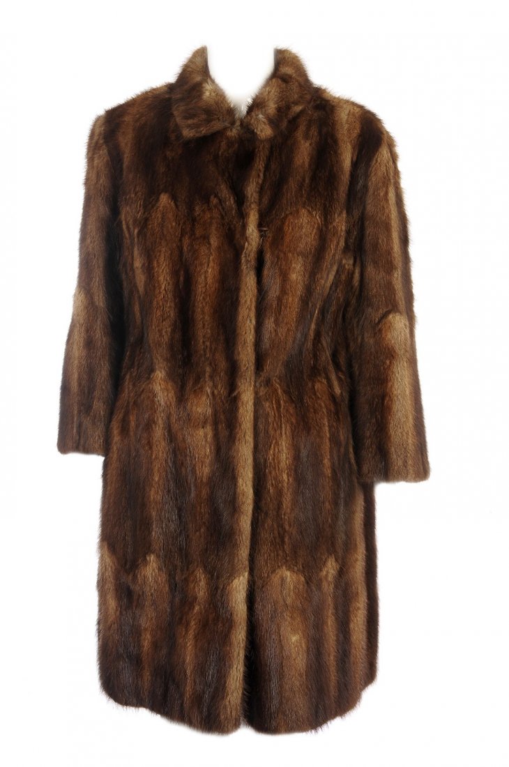 A musquash coat, mink stole and mink accessories.: A musquash coat, mink stole and mink accessories. The knee-length coat, designed with a notched lapel collar, hook and eye clip fastenings, two outer pockets and an inner patch pocket, a wild mink sto