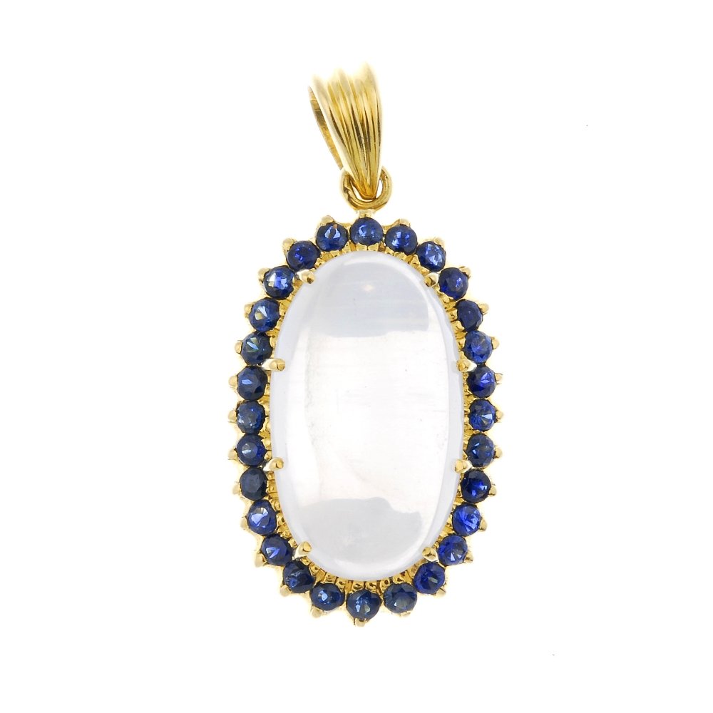 A moonstone and sapphire pendant.: A moonstone and sapphire pendant. The oval moonstone cabochon, within a circular-shape sapphire surround, suspended from a tapered surmount. Length 3.6gms. Weight 8.2gms.