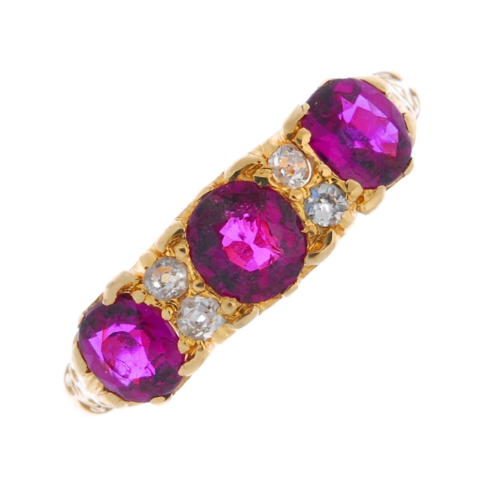An early 20th century gold ruby and diamond three-stone (1 of 3)