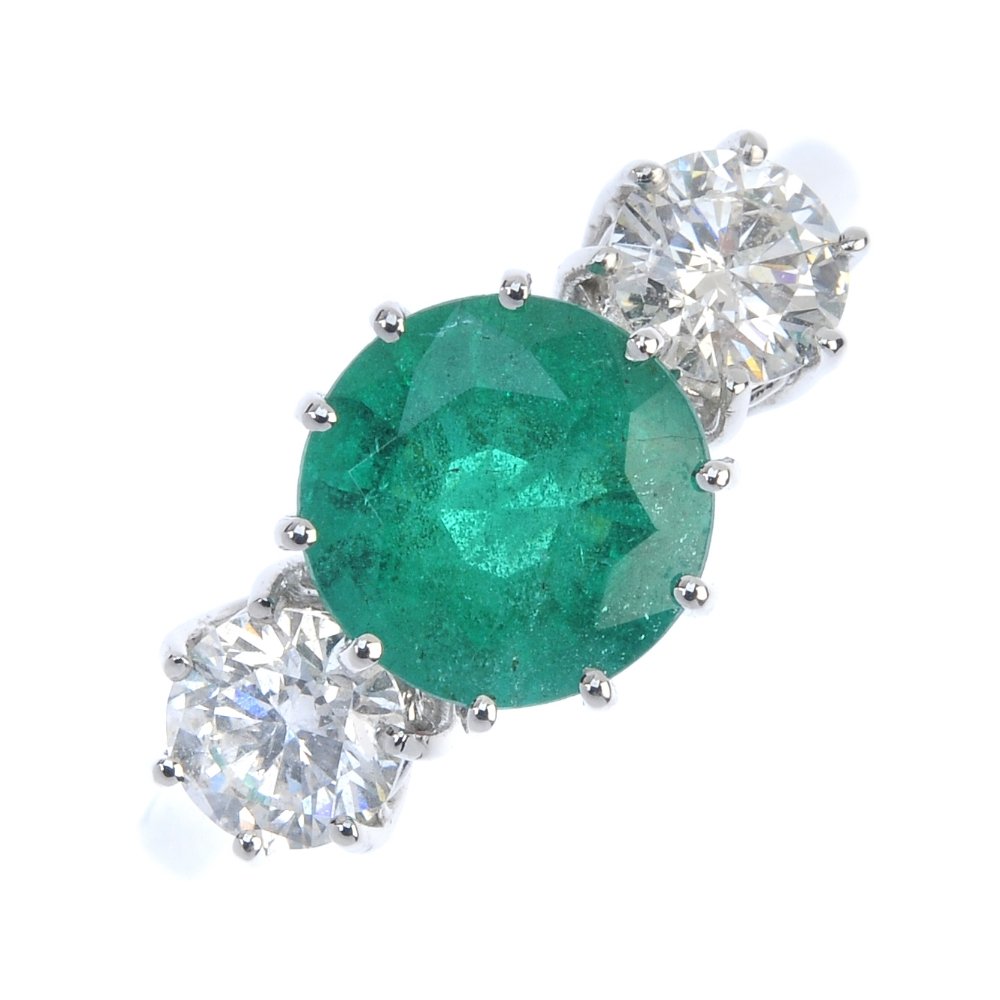 An 18ct white gold emerald and diamond ring. (1 of 3)