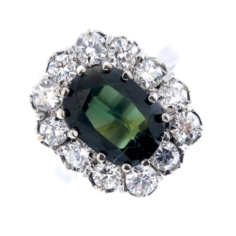 A sapphire and diamond cluster ring. (1 of 3)