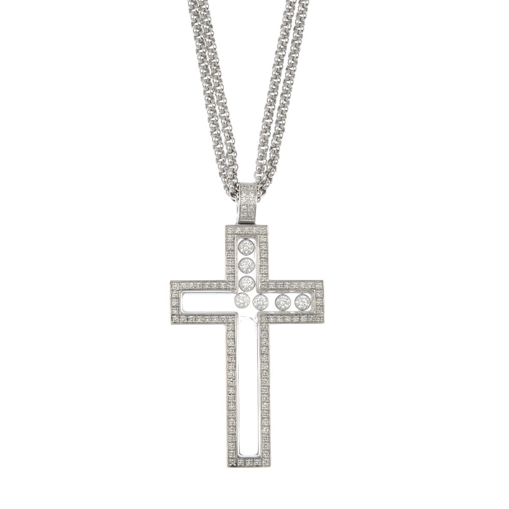 CHOPARD - an 18ct gold 'Happy Diamonds' cross pendant. (1 of 2)