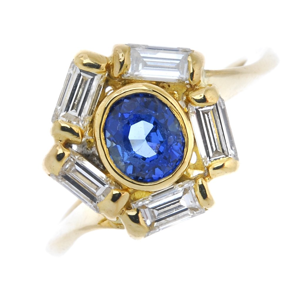 An 18ct gold sapphire and diamond cluster ring. (1 of 3)