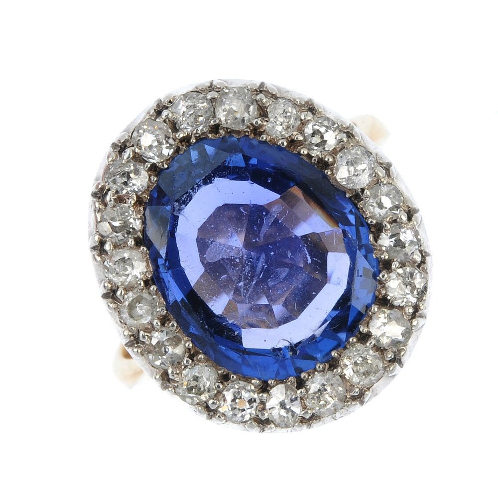 A Burmese sapphire and diamond cluster ring. (1 of 4)