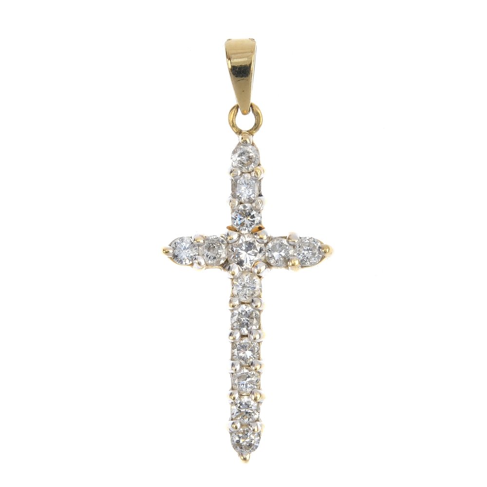 An 18ct gold diamond cross pendant. (1 of 1)