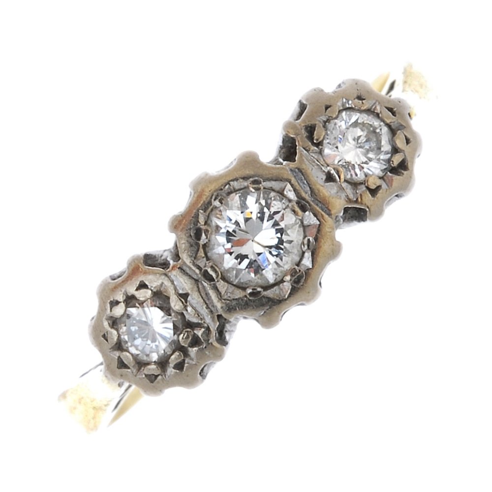 An 18ct gold diamond three-stone ring. (1 of 4)