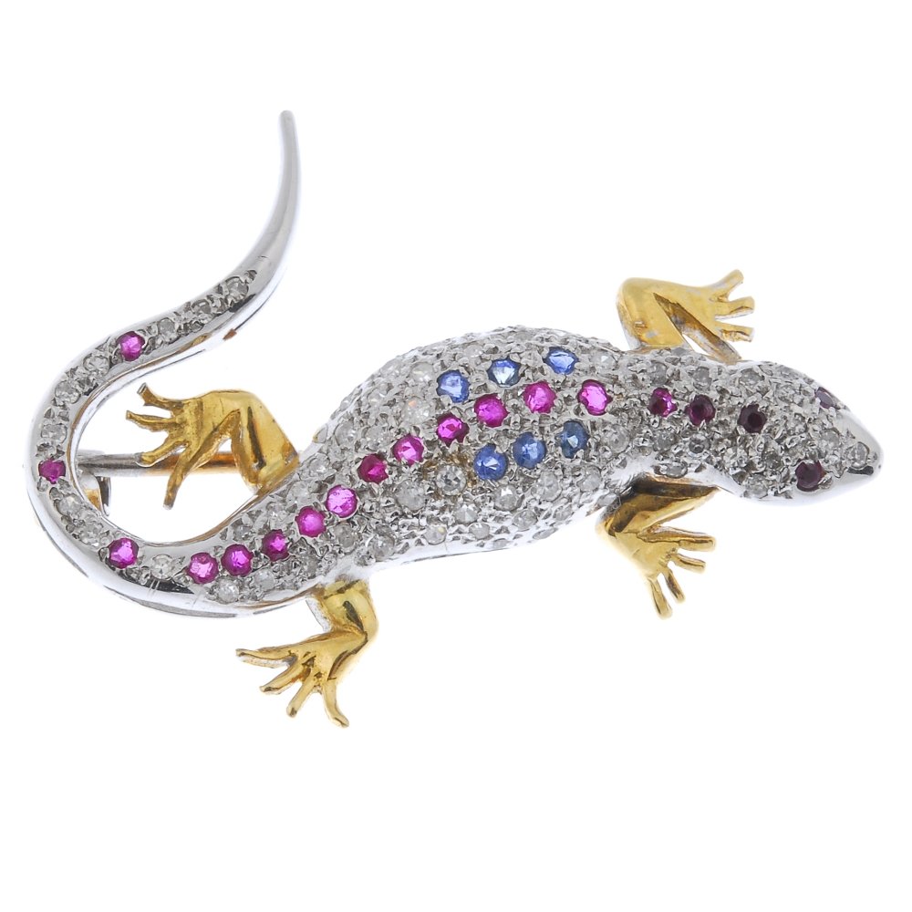 A diamond, ruby and sapphire lizard brooch. (1 of 2)