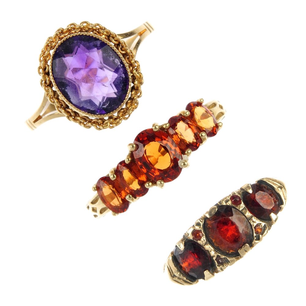 A selection of four 9ct gem-set rings. (1 of 3)