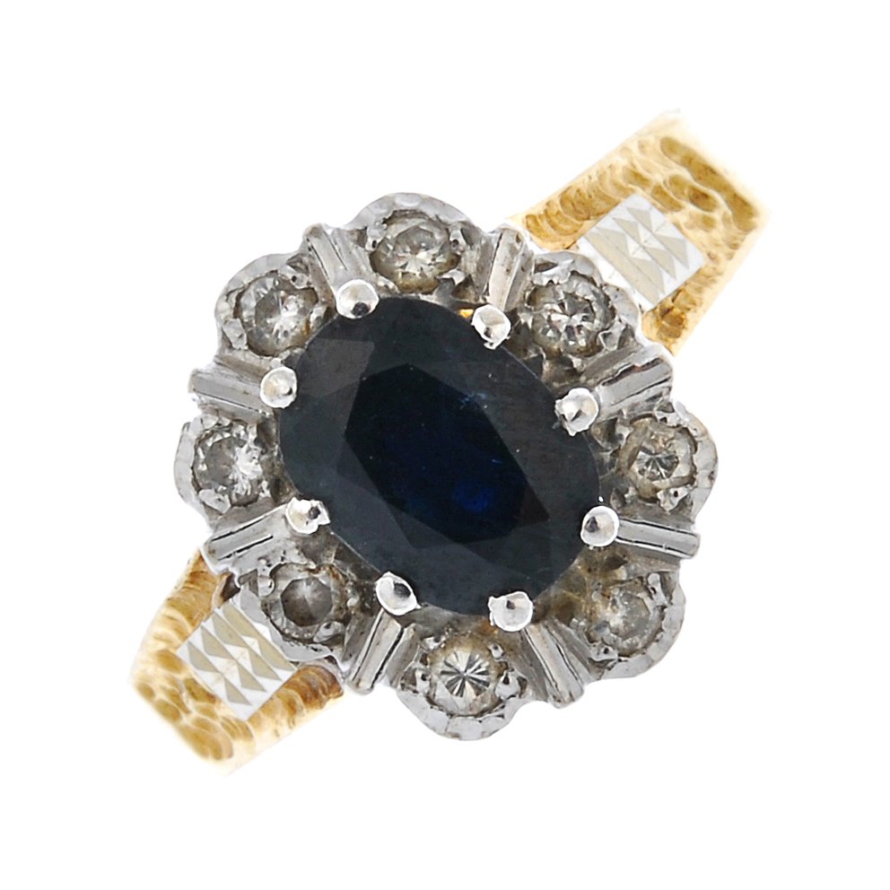 An 18ct gold sapphire and diamond cluster ring. (1 of 4)
