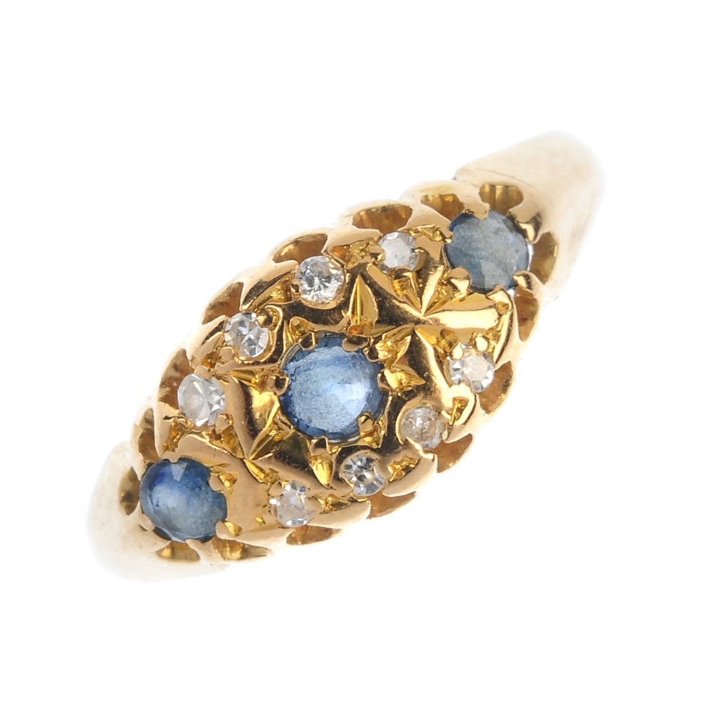 An 18ct gold sapphire and diamond ring. (1 of 4)