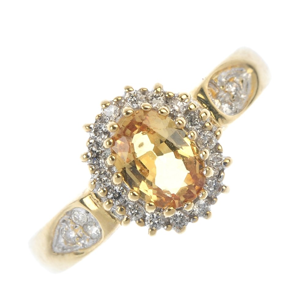 A 9ct gold citrine and diamond cluster ring. (1 of 4)