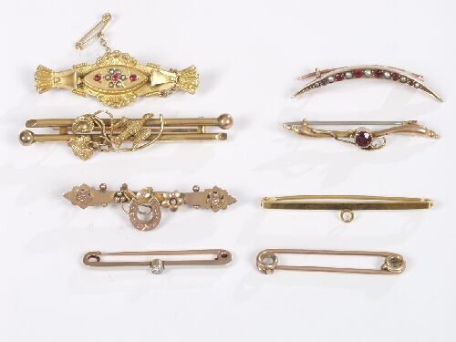 A group of gold brooches, including a d