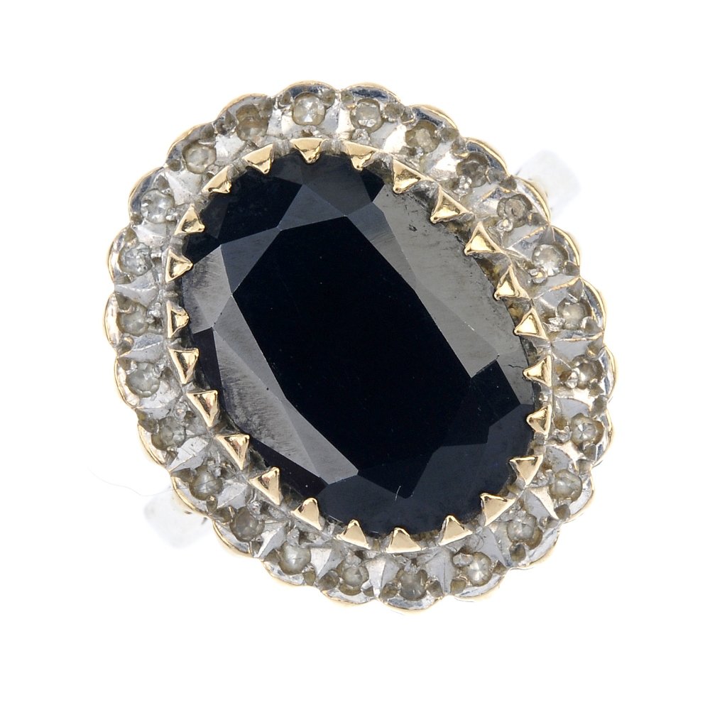 A 9ct gold sapphire and diamond cluster ring. (1 of 4)