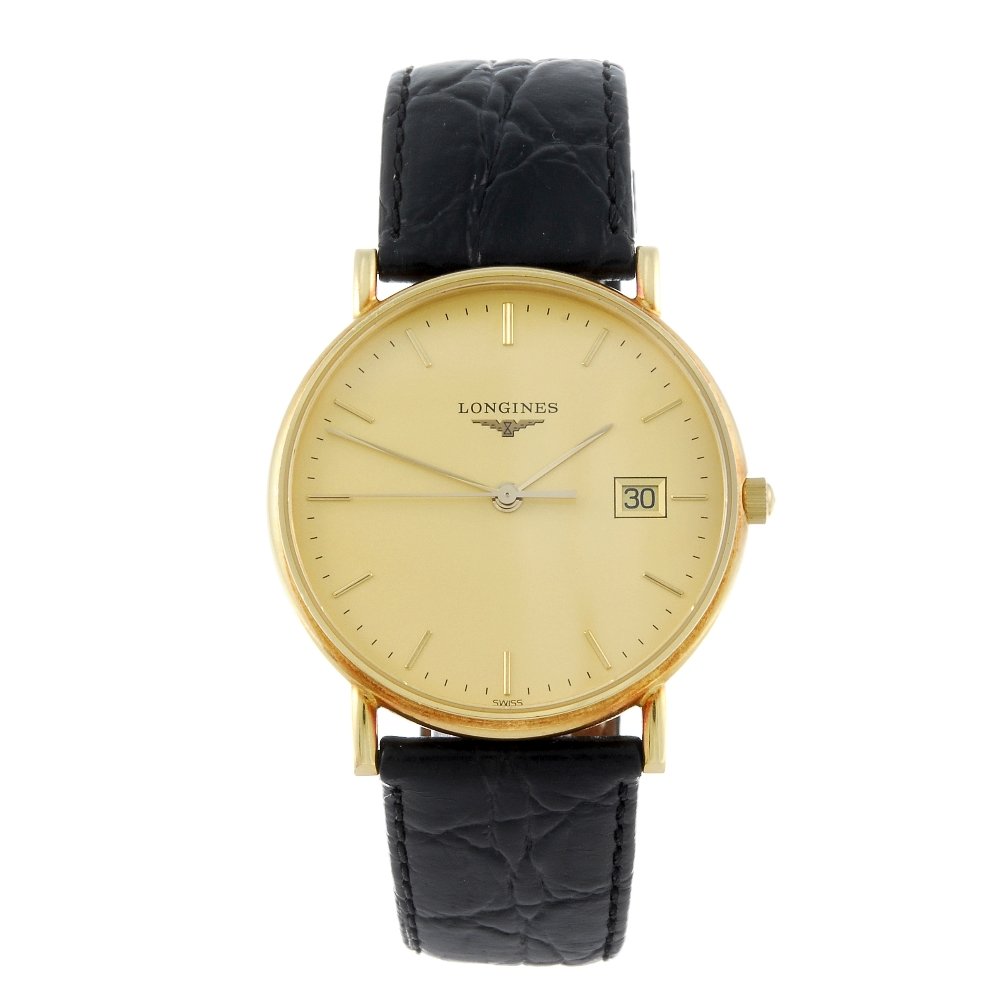 LONGINES - a gentleman's 18ct yellow gold wrist watch.: LONGINES - a gentleman's wrist watch. 18ct yellow gold case. Reference L4 743 6, serial 31413020. Signed quartz calibre L.156.2 with quick date set. Champagne dial with baton hour markers, date apertu