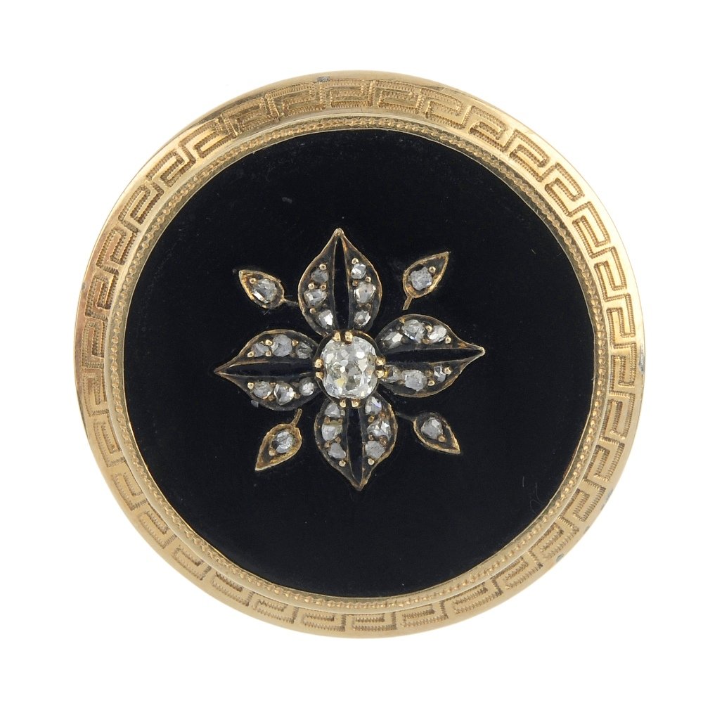 A late 19th century gold diamond and onyx brooch. (1 of 2)