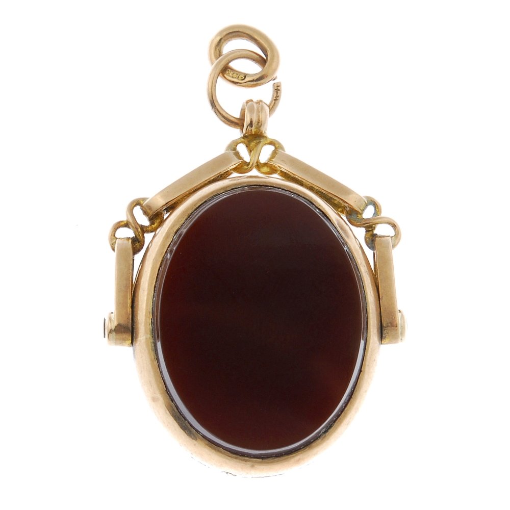 An early 20th century 9ct gold hard stone swivel fob. (1 of 2)