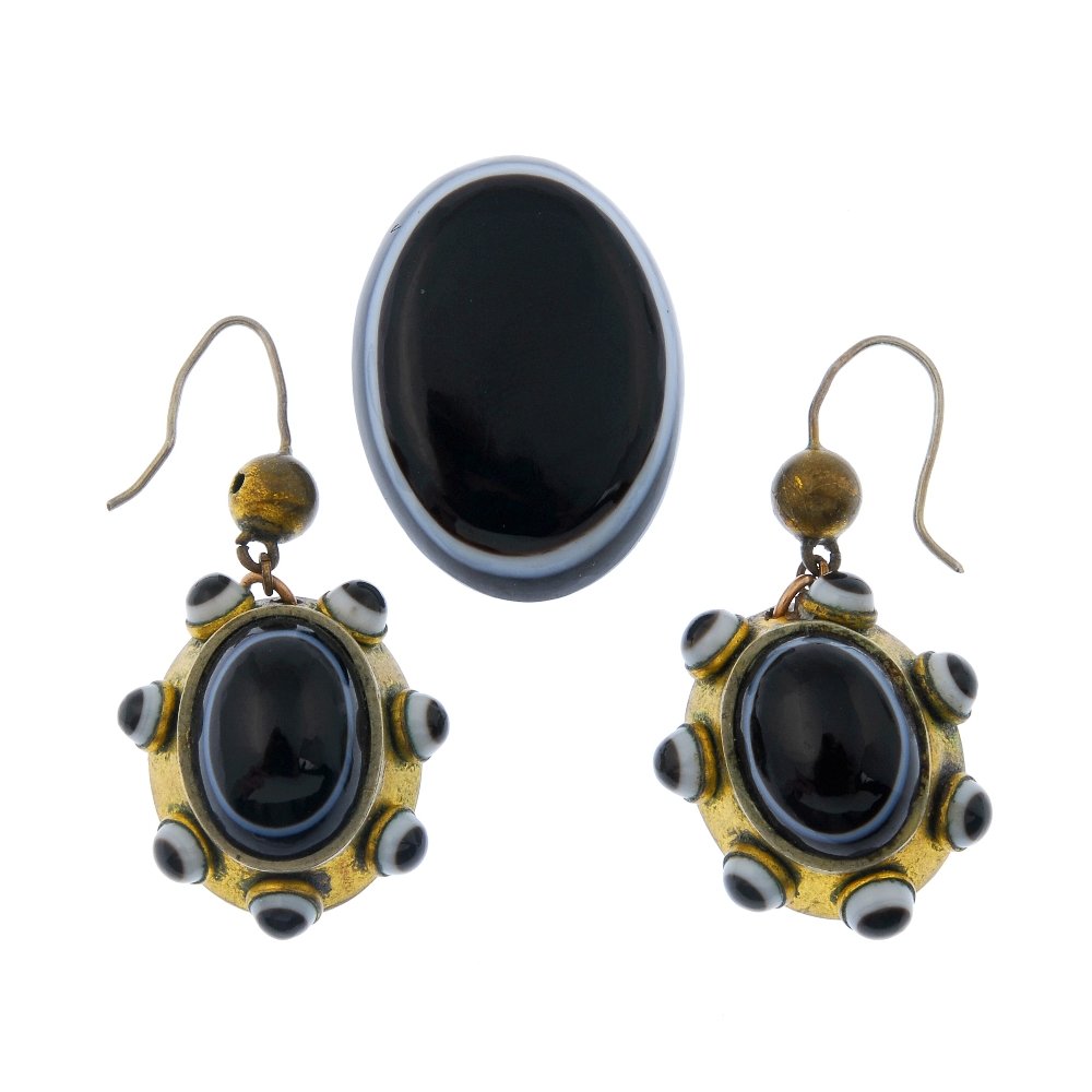 A pair of banded agate earrings and a loose banded: A pair of banded agate ear pendants and a loose banded agate cabochon. Each ear pendant designed as an oval banded agate cabochon, to the curved panel surround with circular agate cabochon accents, to