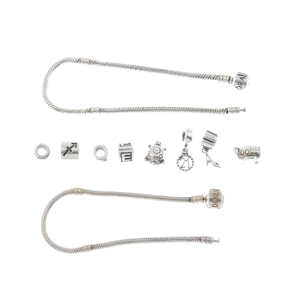 PANDORA - two charm bracelets and loose charms.: PANDORA - two charm bracelets and loose charms. The two snake-link bracelets, together with eight loose charms, to include an aeroplane, a turtle and an initial E charm. One charm AF. Maker's marks fo
