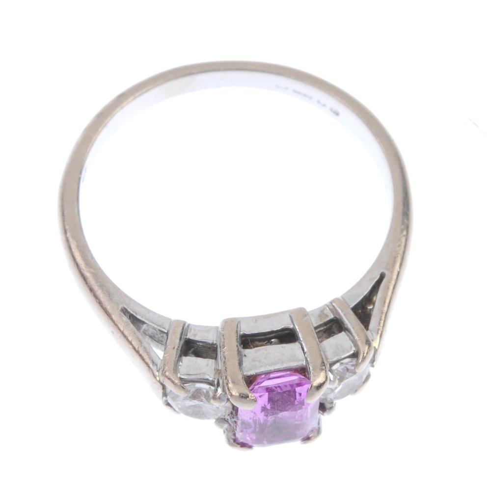 An 18ct gold sapphire and diamond three-stone ring. (1 of 3)
