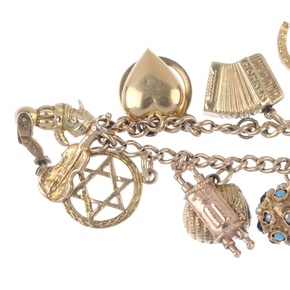 A mid 20th century gold charm bracelet. (1 of 2)