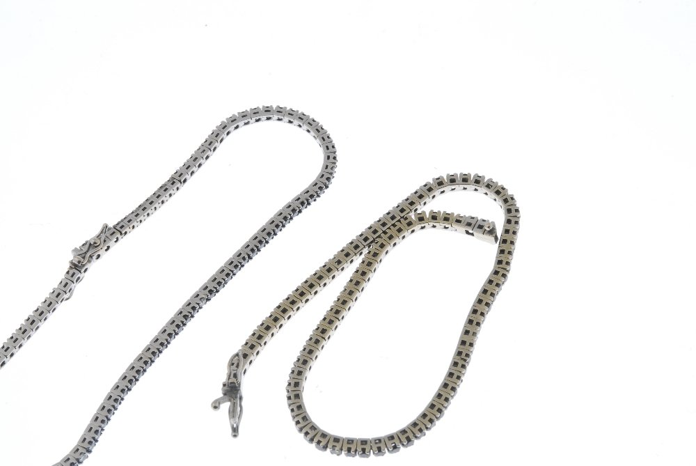 Two diamond and gem-set bracelets, one by Chimento.: Two diamond and gem-set bracelets. Each designed as a circular-shape black gem line, with brilliant-cut diamond spacers. One signed Chimento. Estimated total diamond weight 0.30ct. Lengths 19.7 and 20