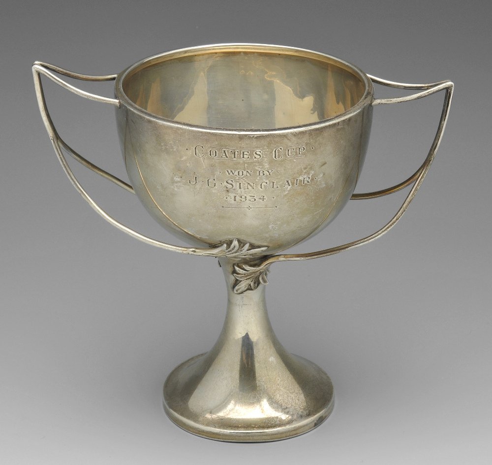 A 1930's trophy cup & a 1930's golfing mug. (2). (1 of 10)