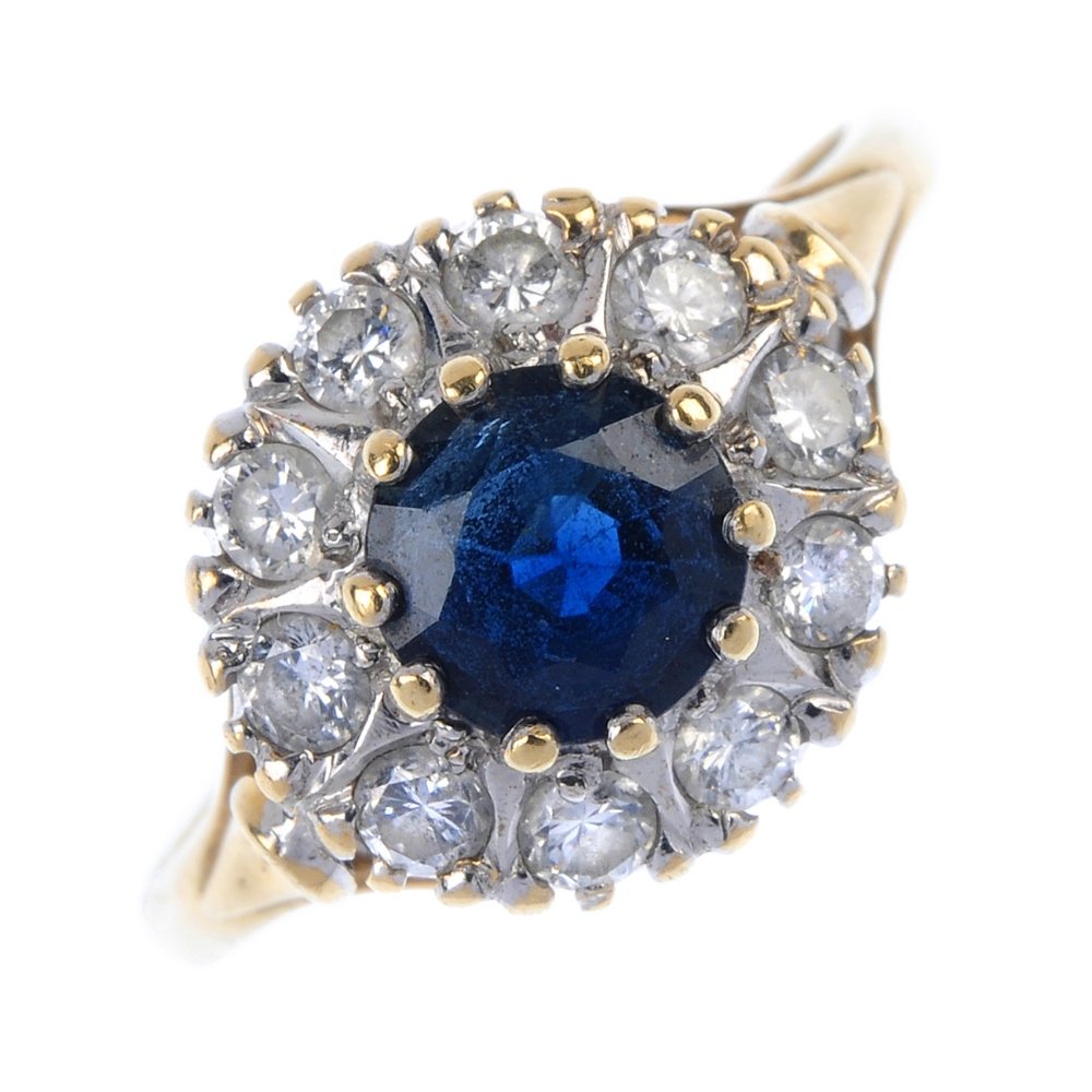 A 9ct gold sapphire and diamond cluster ring. (1 of 4)