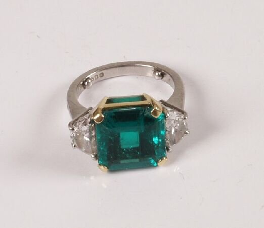 Platinum mounted square cut emerald and diamond thr