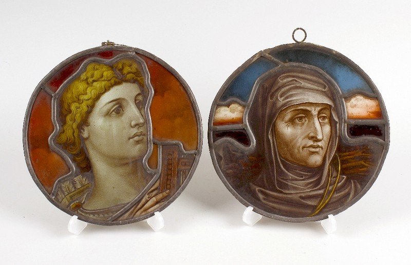 A pair of circular stained glass panels, by T.W. Camm.: A pair of circular stained glass panels, by T.W. Camm. Depicting a head and shoulder portrait of "Dante" and a similar portrait of "Virgil" each, 8.25" (21cm) diameter. Together with a pencil sketch d