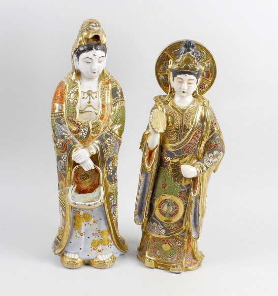 An Oriental pottery figure, plus another.: An Oriental Pottery figure, depicting a female dressed in flowing robes, carrying a basket laden with fish, decorated in a Satsuma style pallette, height 19.75" (50cm). Together with a similar smaller