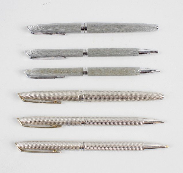 A Waterman silver bodied fountain pen, ball point pen: A Waterman silver bodied fountain pen, having nib stamped 18k 750 and textured body marked 925 and with London import marks, plus a similar ballpoint pen and mechanical pencil. Together with similar W