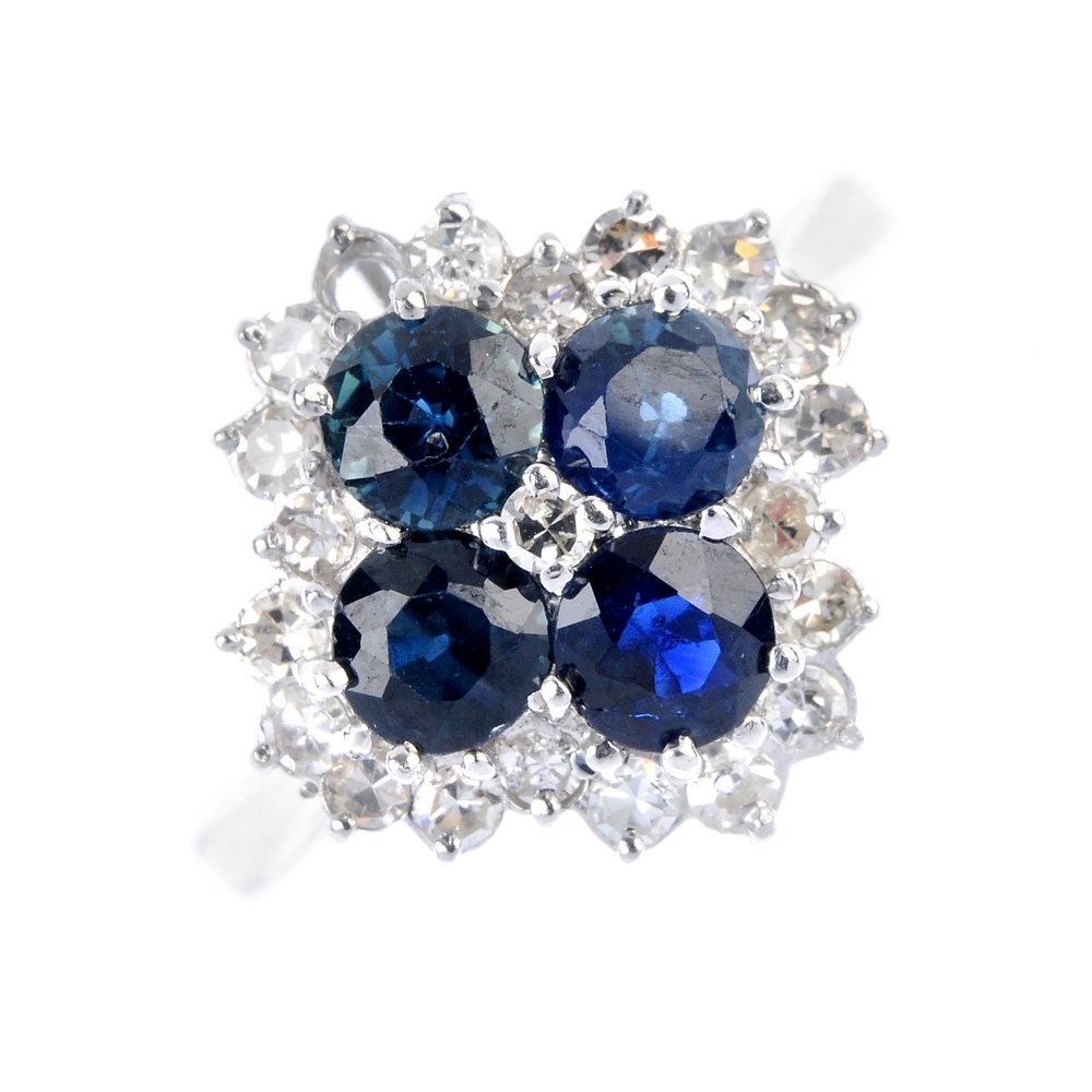 An 18ct gold sapphire and diamond cluster ring. (1 of 4)