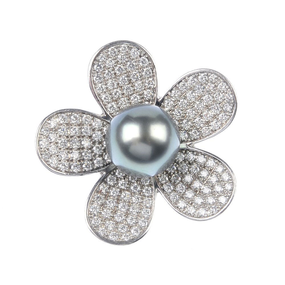 A cultured pearl and diamond flower ring. (1 of 3)