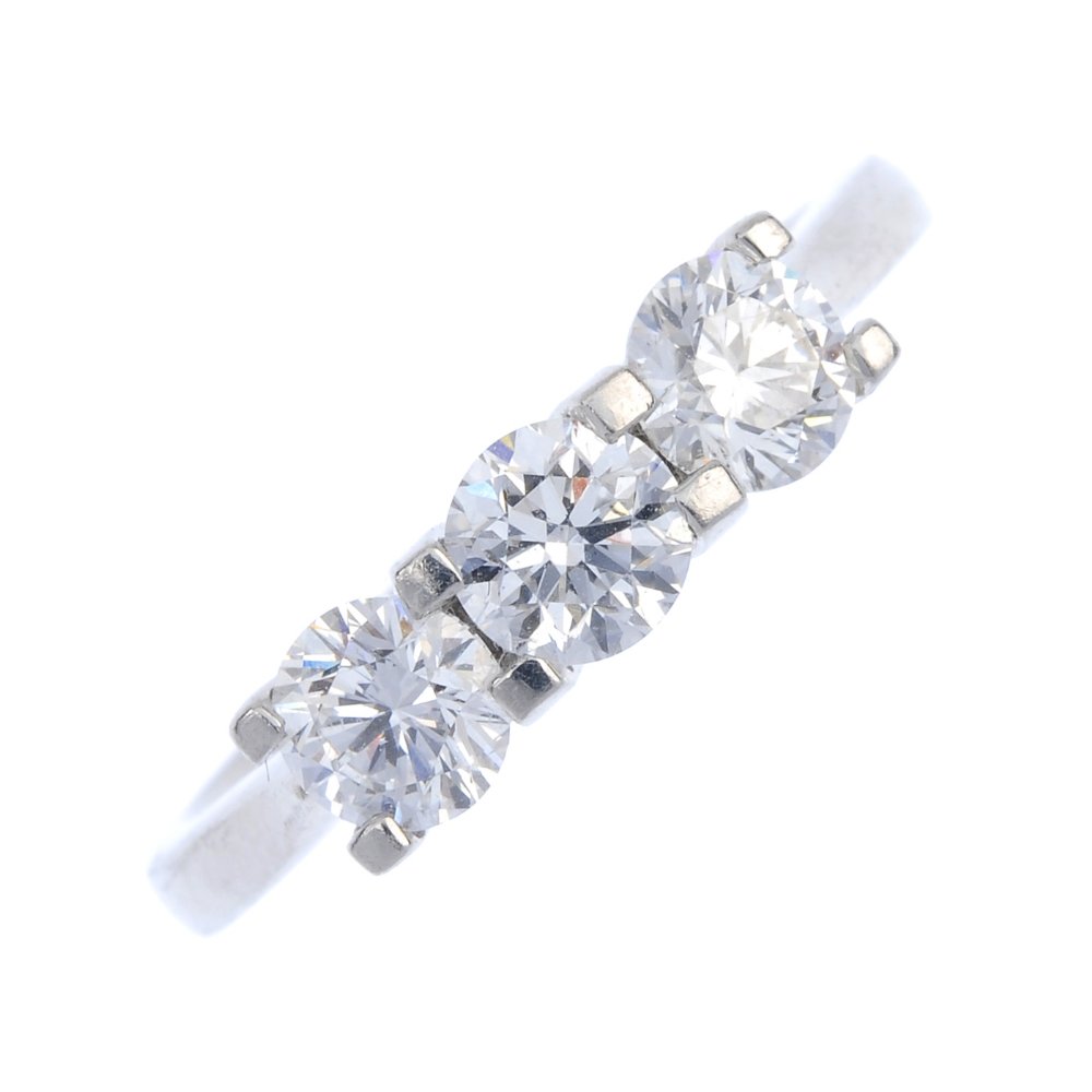 A platinum diamond three-stone ring. (1 of 4)