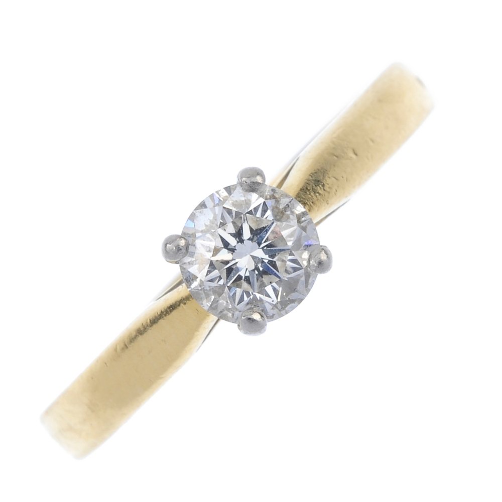 An 18ct gold diamond single-stone ring. (1 of 4)