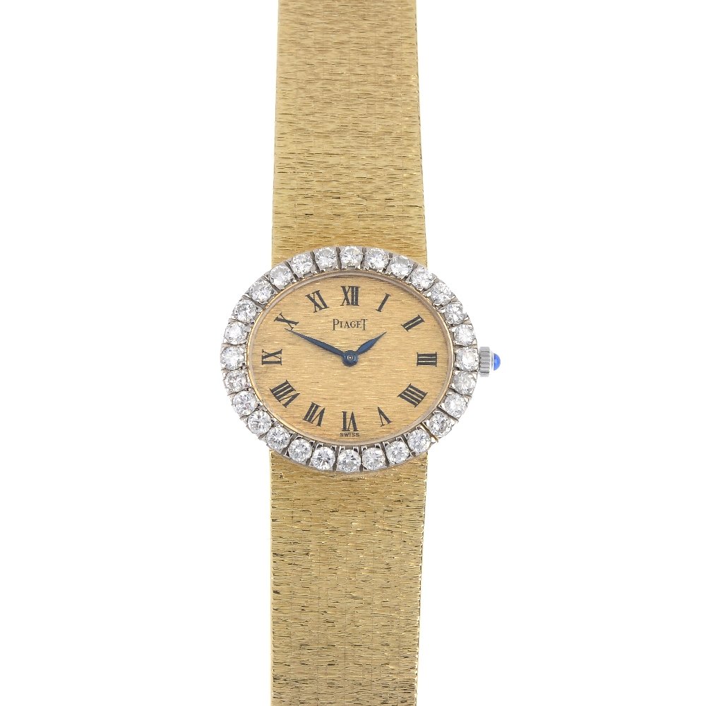 PIAGET - an 18ct gold diamond dress watch. (1 of 3)