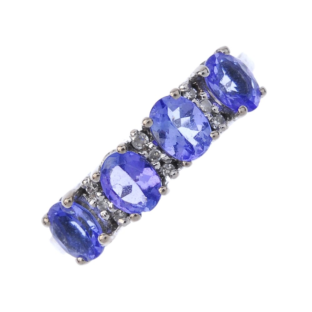 An 18ct gold tanzanite and diamond ring. (1 of 4)