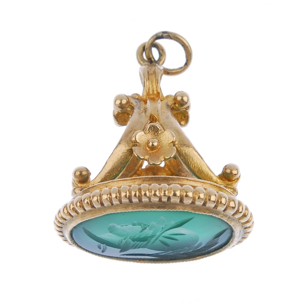 A gold gem-set fob.: A gold gem-set fob. The oval-shape green chalcedony with intaglio depicting the head of a centurion to the floral pedestal. Hallmark for Birmingham, 1989. Length 2.7cms. Weight 4.8gms.