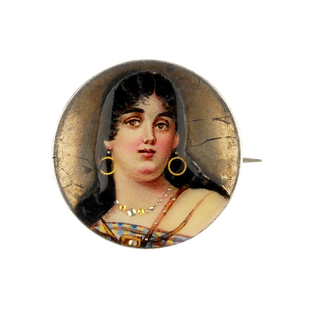 A painted enamel portrait brooch. (1 of 2)