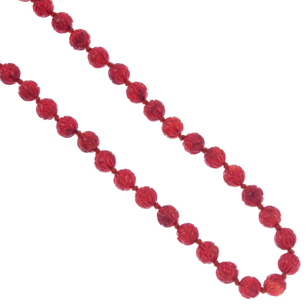 A carved sponge coral bead necklace. (1 of 2)