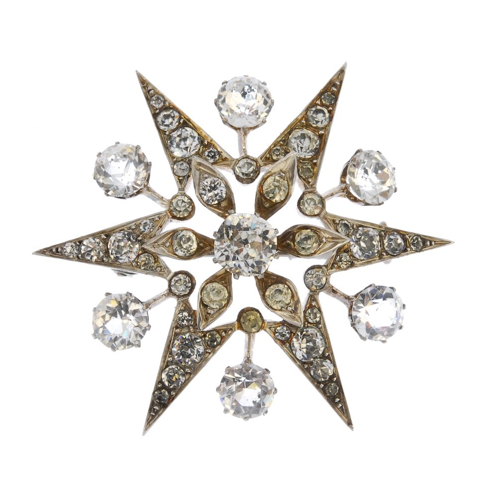 A late 19th century paste star brooch.: A late 19th century paste star brooch. The cushion-shape paste, to the similarly-set paste star surround with circular-shape paste intervals. Length 4.8cms. Weight 15.9gms.