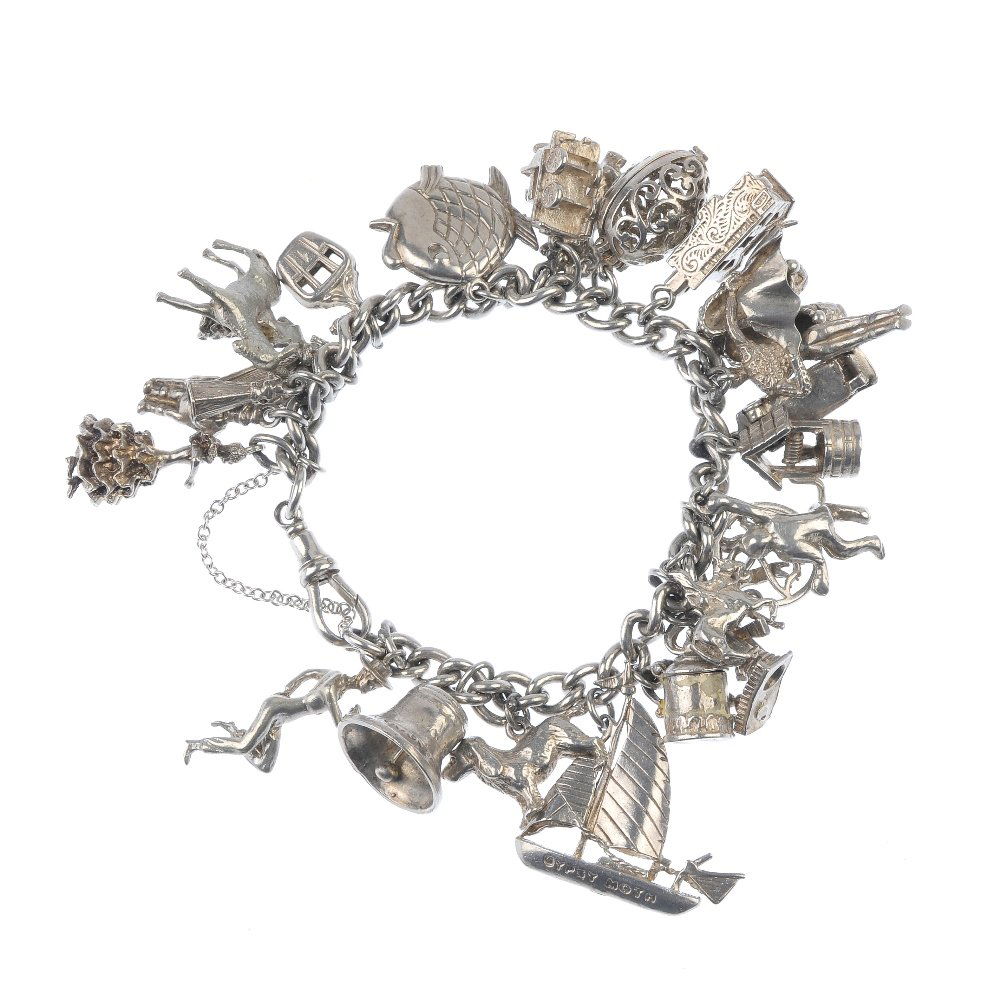 Two charm bracelets.: Two charm bracelets. The curb-link bracelets suspending a total of forty-six charms, to include a bell, a train, a baby in a pram and a crown. Many with marks to indicate silver. Lengths 18 and 20cms.