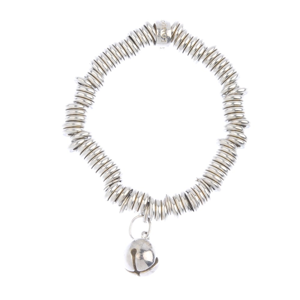 LINKS OF LONDON - three 'Sweetie' charm bracelets.: LINKS OF LONDON - three 'Sweetie' charm bracelets. One suspending a bell charm another suspending a heart charm. All signed Links of London. Inner diameters 6 to 6.5cms. Weight 163.2gms.