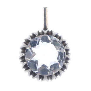 BENGT HALLBERG - a rock crystal pendant.: BENGT HALLBERG - a rock crystal pendant. The circular rock crystal set with marquise-shape claws, to the rectangular surmount loop. With maker's mark. Hallmark illegible. Length 3cms. Weight 8.7gms.