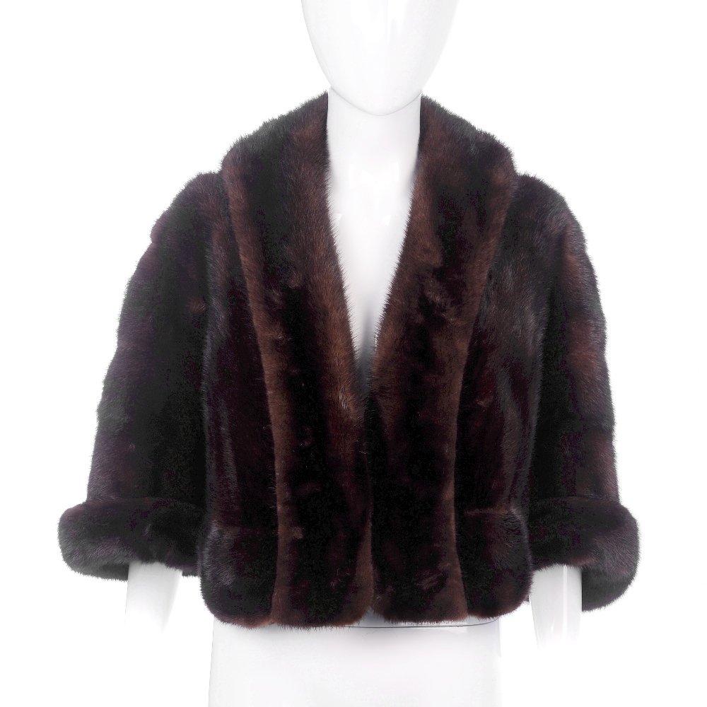 A ranch mink bolero.: A ranch mink bolero. Designed with an open front, featuring a collar with extended front panels, cropped dolman sleeves with rolled cuffs and inner stitched initials.