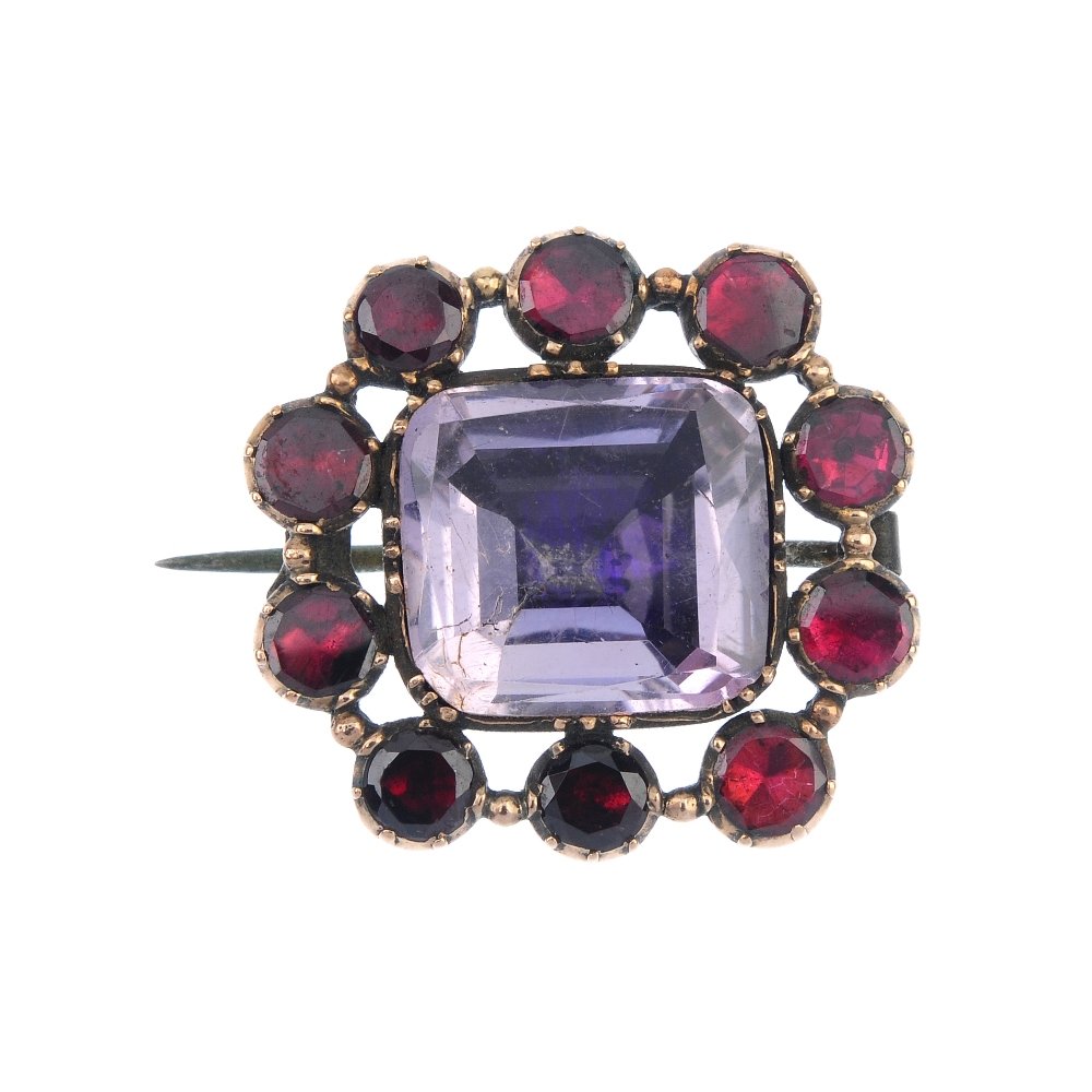 A late 19th century gold amethyst and garnet brooch. (1 of 2)