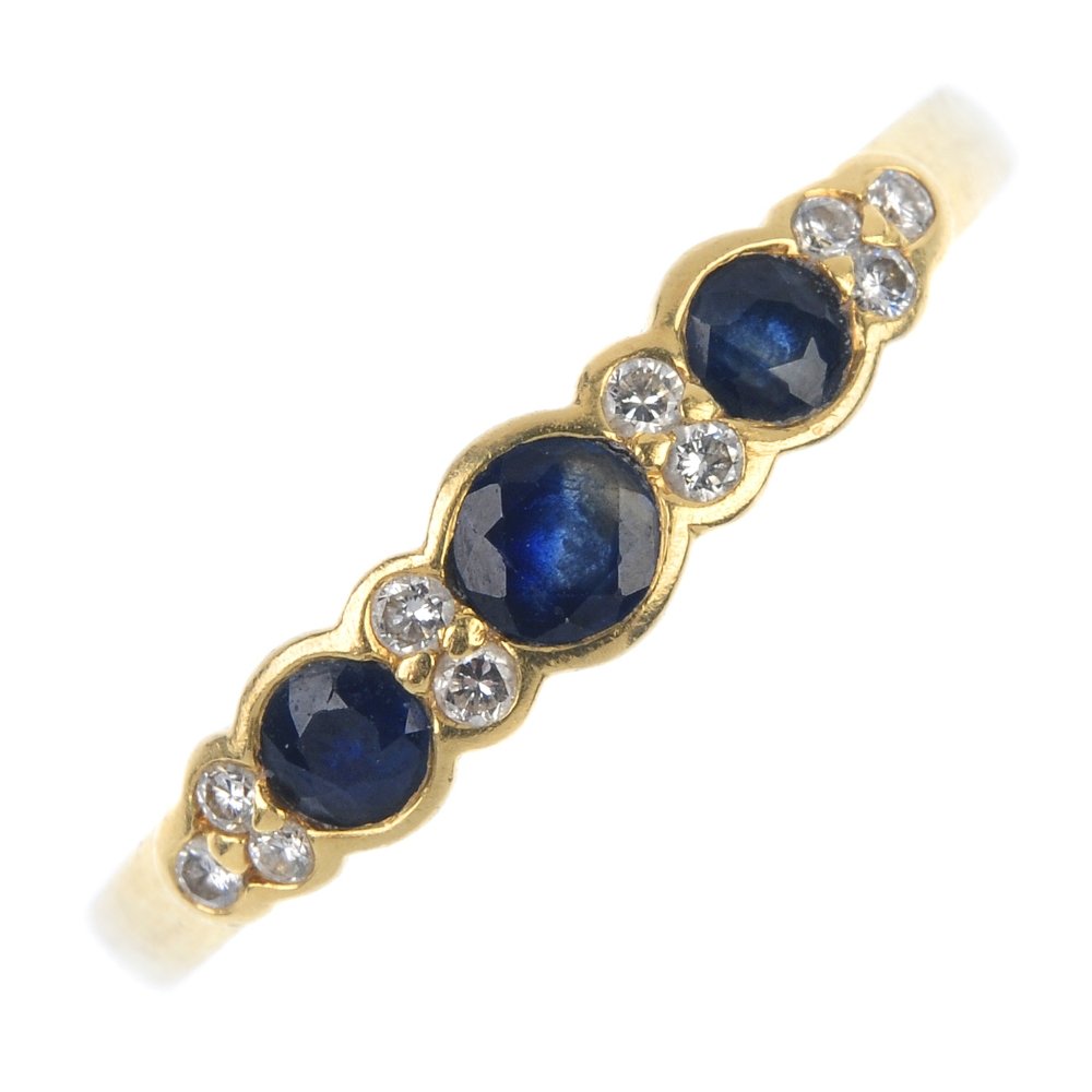 An 18ct gold sapphire and diamond dress ring. (1 of 4)